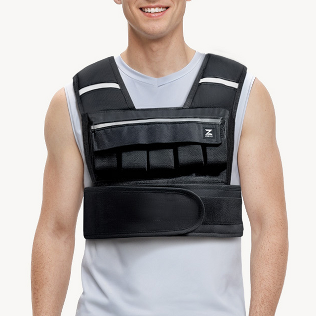 Person wearing a black weighted vest on a white background