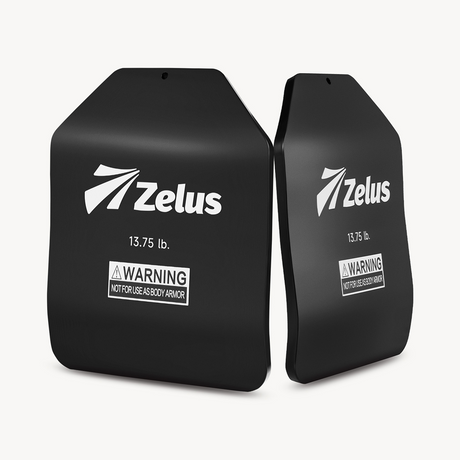 Two black Zelus performance plates on a white background