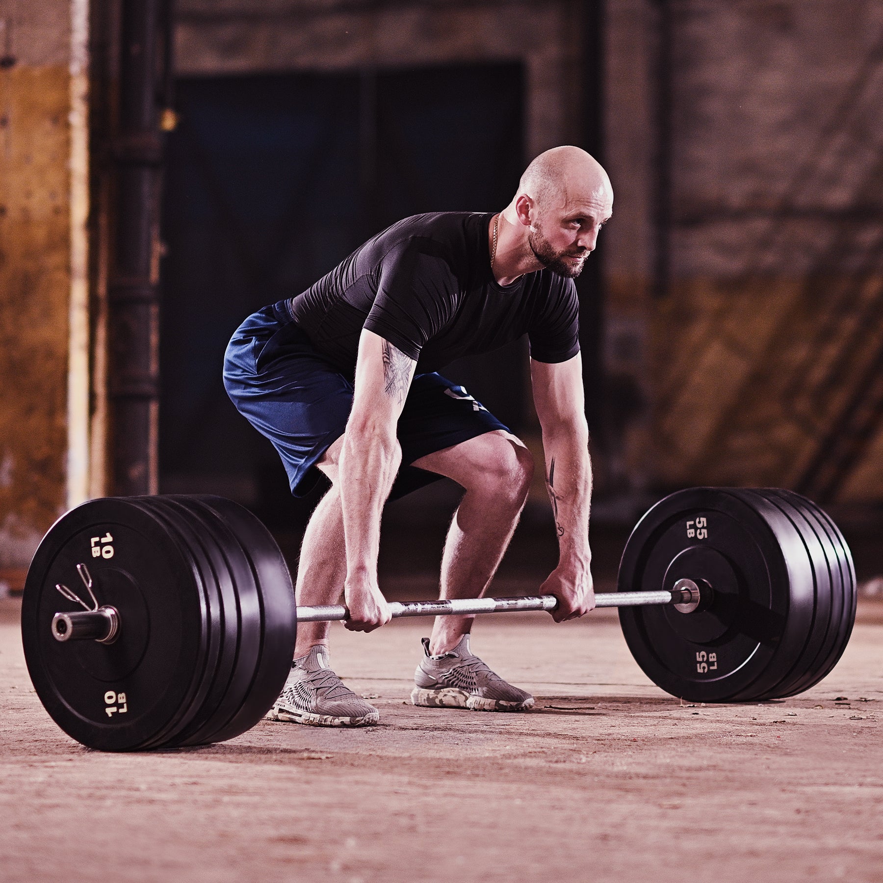 Two black weight plates with '10 LB' marking