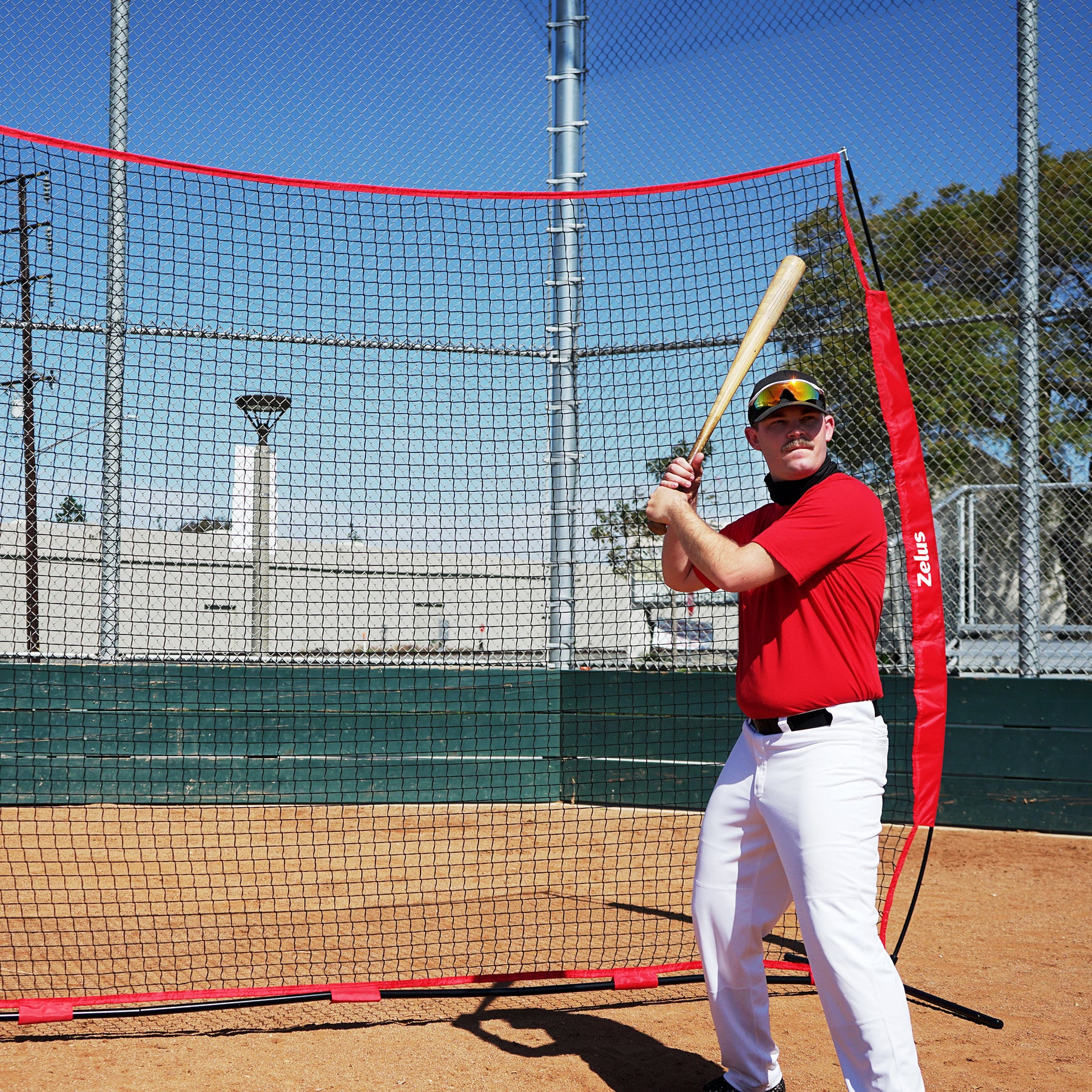 Red and black sports training net with Zelus branding