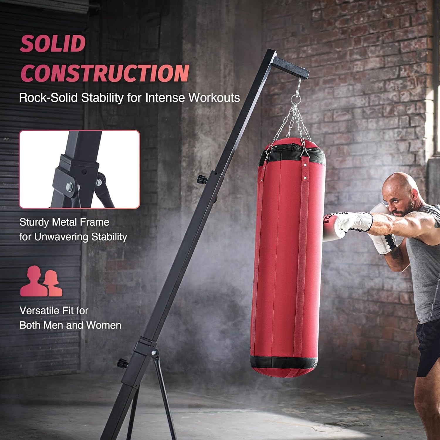 Red punching bag with metal frame in a gym setting.