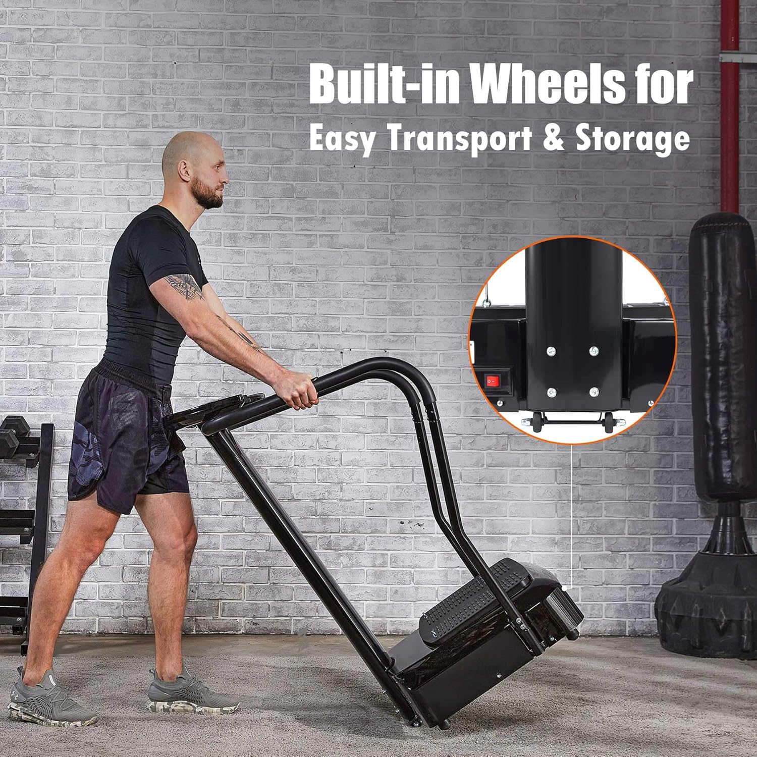 Man pushing a black storage unit with wheels against a brick wall.