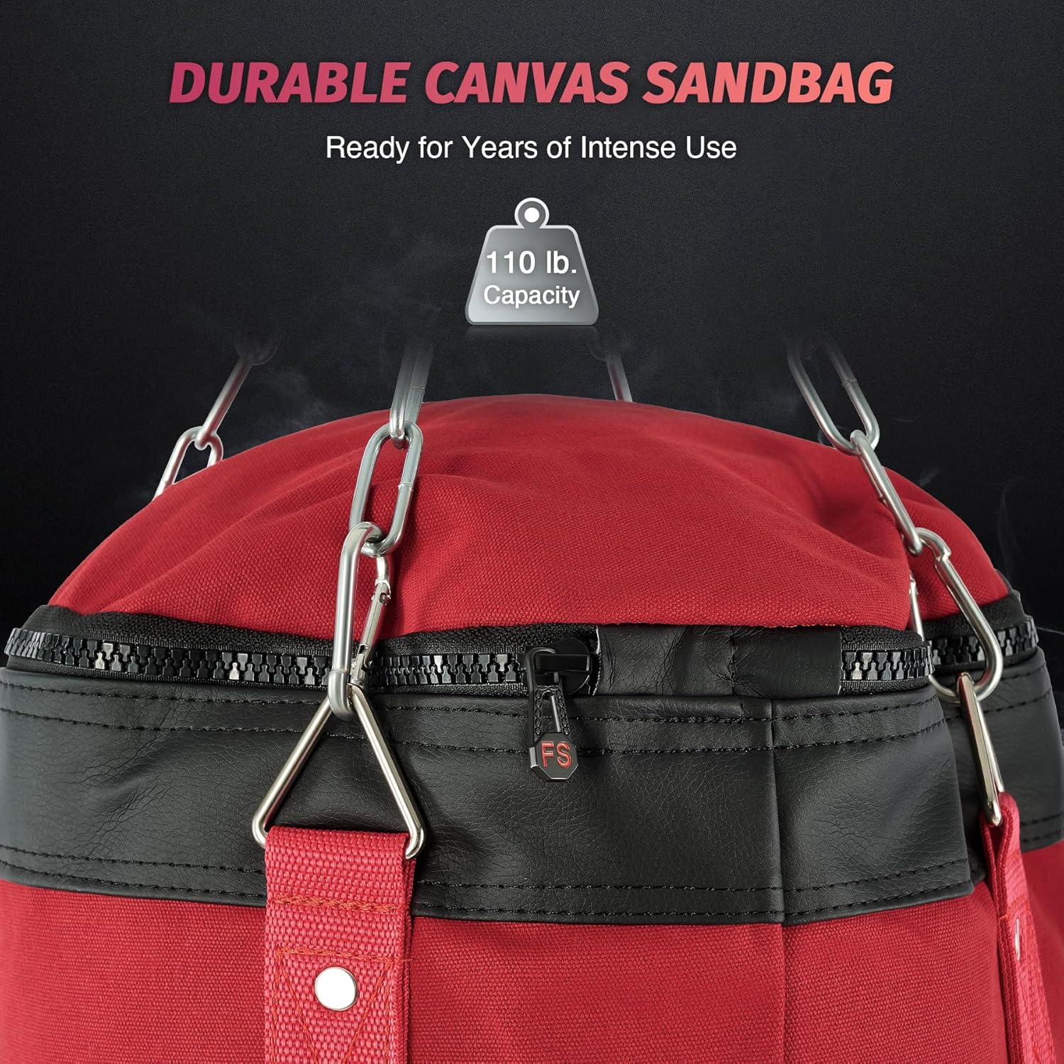 Red and black sandbag with durable canvas material and metal hooks on a black background.